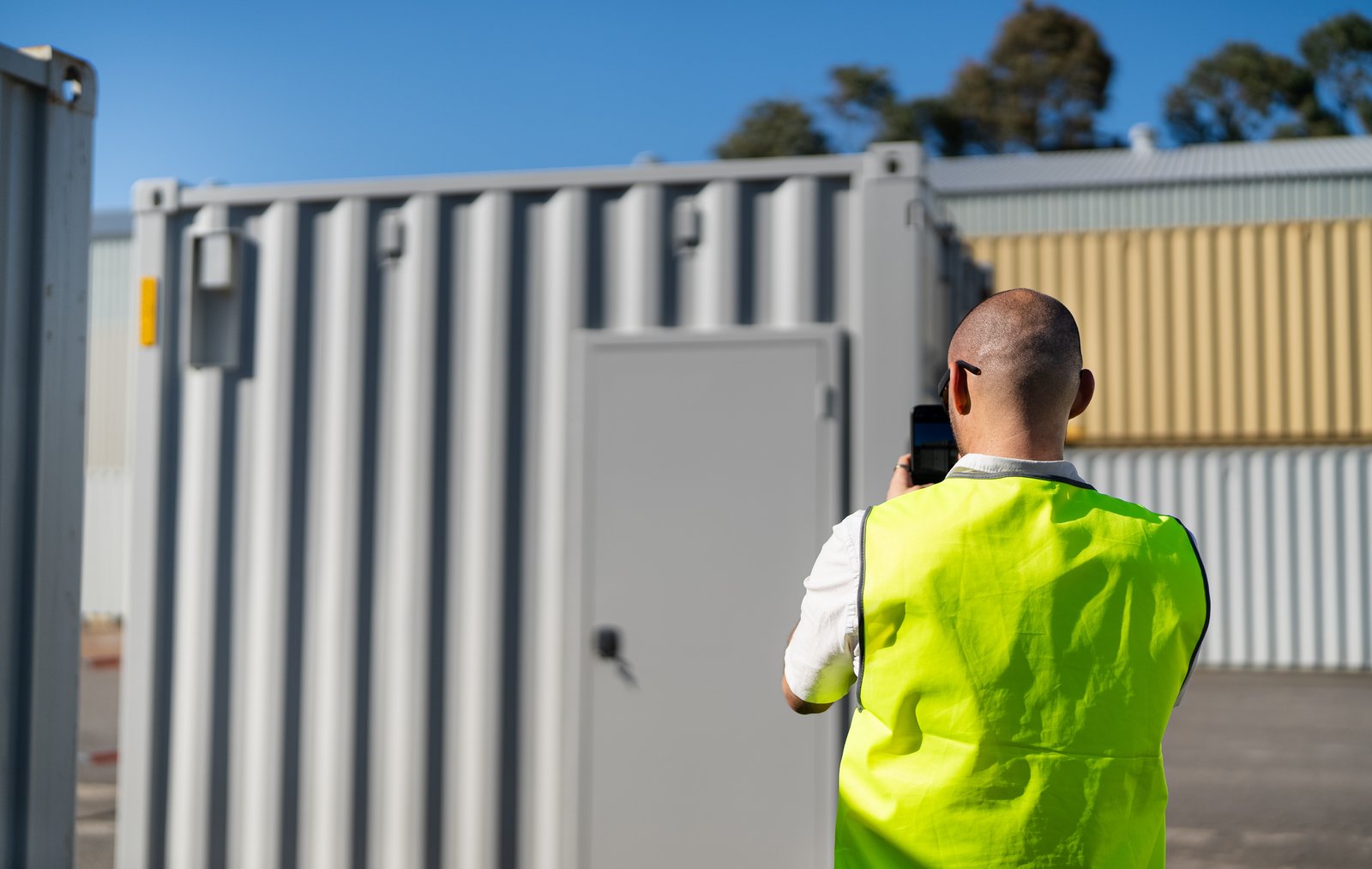 Customer taking a photo of a Modulate Portable cafe unit on the Modulate Group Build Lot in Newcastle, Aus. 